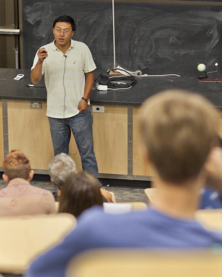 Zheng Zheng, associate professor of physics and astronomy lectures his universe class, Monday, August 31, 2015. Photo credit: Mike Sheehan
