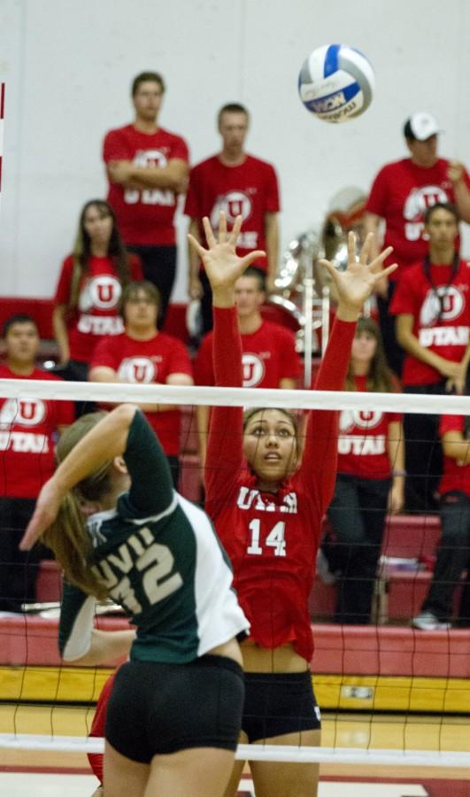 Utah sophomore, Adora Anae (14), leaps into the air to block a shot at the Utah UVU game on Sept. 9, 2014