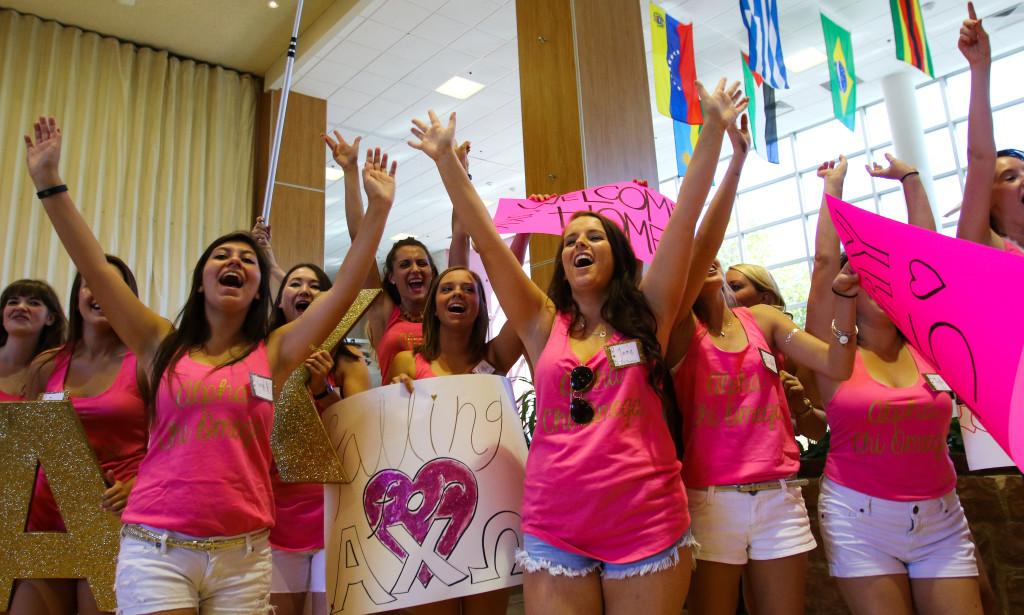 Members of the Alpha Chi Omega sorority cheer at the start of Bid Day at the Union Ballroom, Tuesday, September 8, 2015. Chris Samuels, Daily Utah Chronicle.