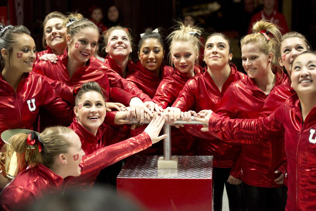 Utah Chronicle File Photo, Utah Gymnastics team lighting the U after the meet vs. Michigan, Friday, Mar. 6, 2015