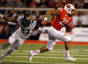 Utah running back Devontae Booker (23) runs past a defender in the first half against the Cal Bears during a Pac-12 football game at Rice Eccles Stadium in Salt Lake City, Saturday, Oct. 10, 2015.