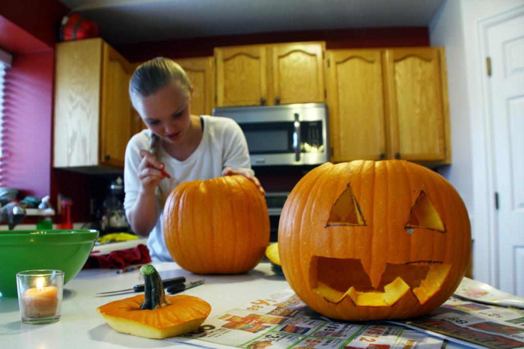 Bryn Koldewyn carves a pumpkin at her home in Salt Lake City.