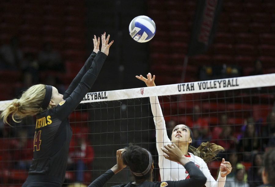 Sophomore outside hitter Eliza Katoa tries to tap the ball over blockers in a Pac-12 volleyball match against the Arizona State Sun Devils at the Huntsman Center, Saturday, Nov. 14, 2015. Chris Ayers, Daily Utah Chronicle.