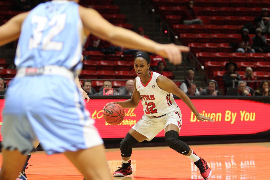 Sophomore Tanaeya Boclair (32) drives against the Fort Louis defense in an exhibition game at the Huntsman center on 6 Nov 2015. Photo credit: Dane Goodwin