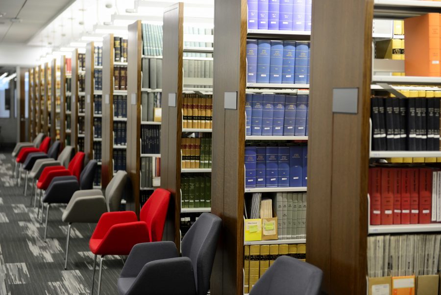 Books on shelves inside the S.J. Quinney College of Law Building on campus on Wednesday, Nov. 25, 2015