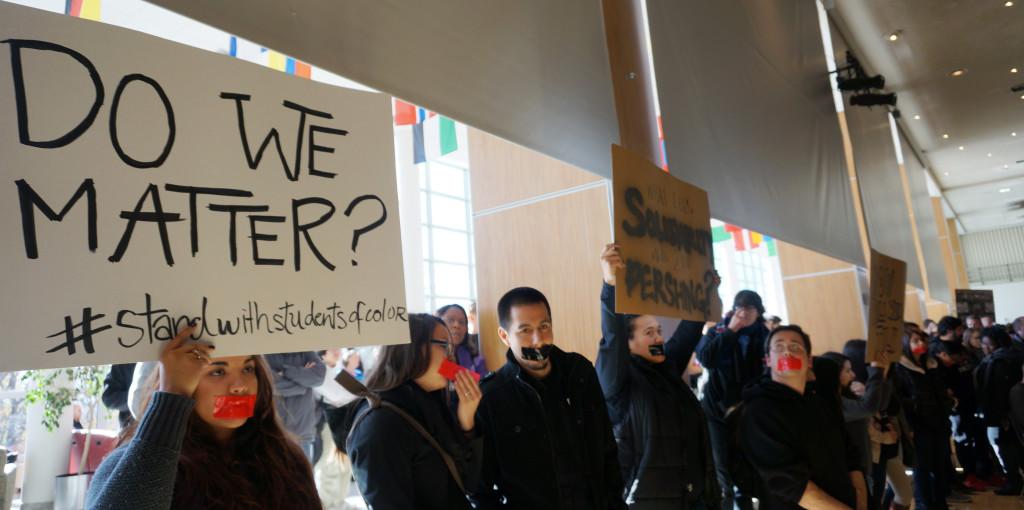 Students of Color hold signs at the Racial Awareness Q&A Session inside the Union Ballroom at the U in Salt Lake City, Utah, on Friday, Nov. 20th, 2015.