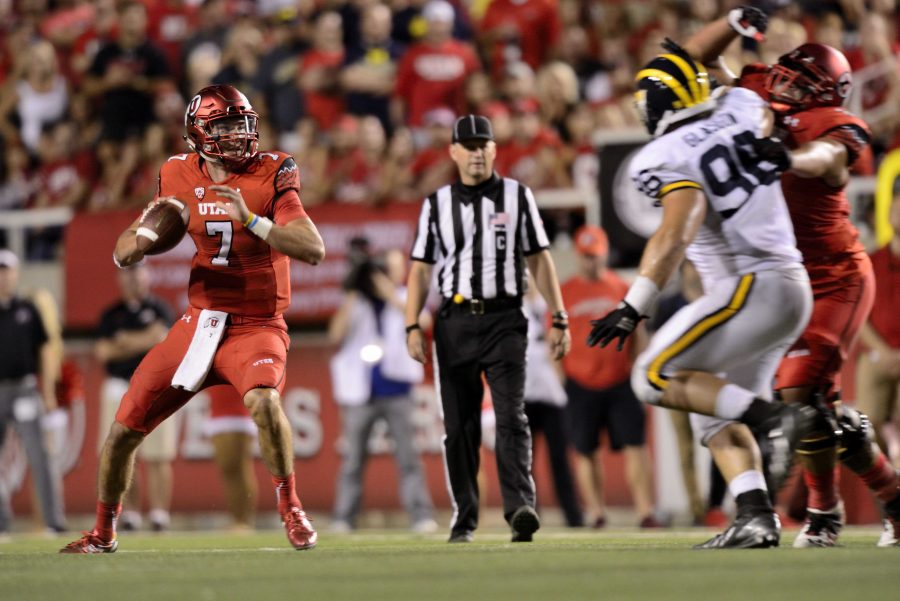 Senior Travis Wilson gets ready to throw the ball; The Utah Utes beat the Michigan Wolverines 24-17 at Rice Eccles Stadium on Thursday, September 3, 2015