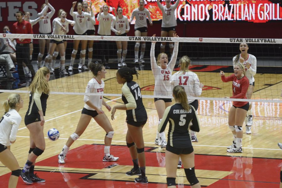 Utah freshman, Jessie Jorgensen (15), cheers after the Utes  blocked the ball from the Buffs to win the point at the Huntsman Events Center; The Utah Utes beat the Colorado Buffs 3-1 on Wednesday, Sept. 23, 2015