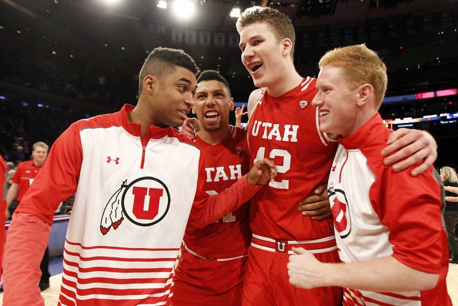 Utah Utes players celebrate after winning during the Ameritas Insurance Classic against the Duke Blue Devils at Madison Square Garden in New York City, Saturday, Dec. 19, 2015.