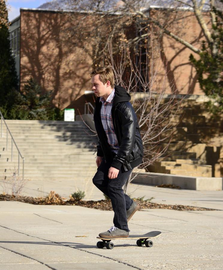 Sam Wood, a senior in architecture, skates after studying for finals. Photo credit: Peter Creveling