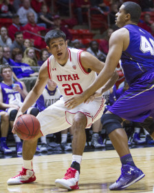 Runnin' Utes junior forward Chris Reyes (20) moves toward the basket at the Utah vs College of Idaho mens basketball game, Monday December 28, 2015.