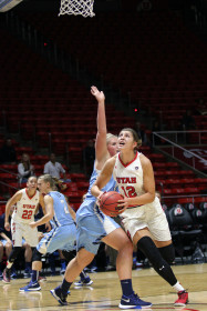 Sophomore Emily Potter goes to the hoop against Fort Louis in an exhibition game at the Huntsman center on 6 Nov 2015.