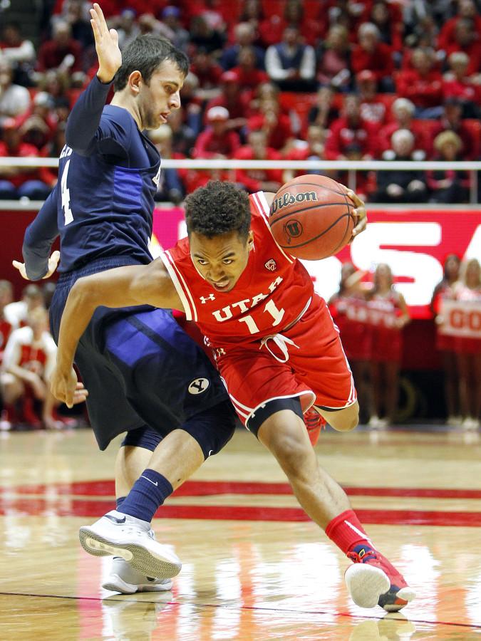 Senior guard Brandon Taylor (11) tried to cut past a defender in the first half of an NCAA mens basketball game against the BYU Cougars at the Jon M. Huntsman Center, Wednesday, Dec. 2, 2015. Chris Samuels, Daily Utah Chronicle. Photo credit: Chris Samuels