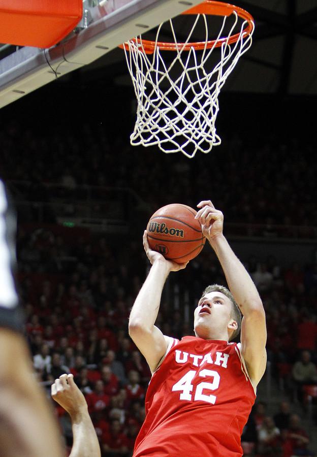 Sophomore center Jakob Poeltl (42) puts the ball near the in the first half of an NCAA mens basketball game against the BYU Cougars at the Jon M. Huntsman Center, Wednesday, Dec. 2, 2015. Chris Samuels, Daily Utah Chronicle.