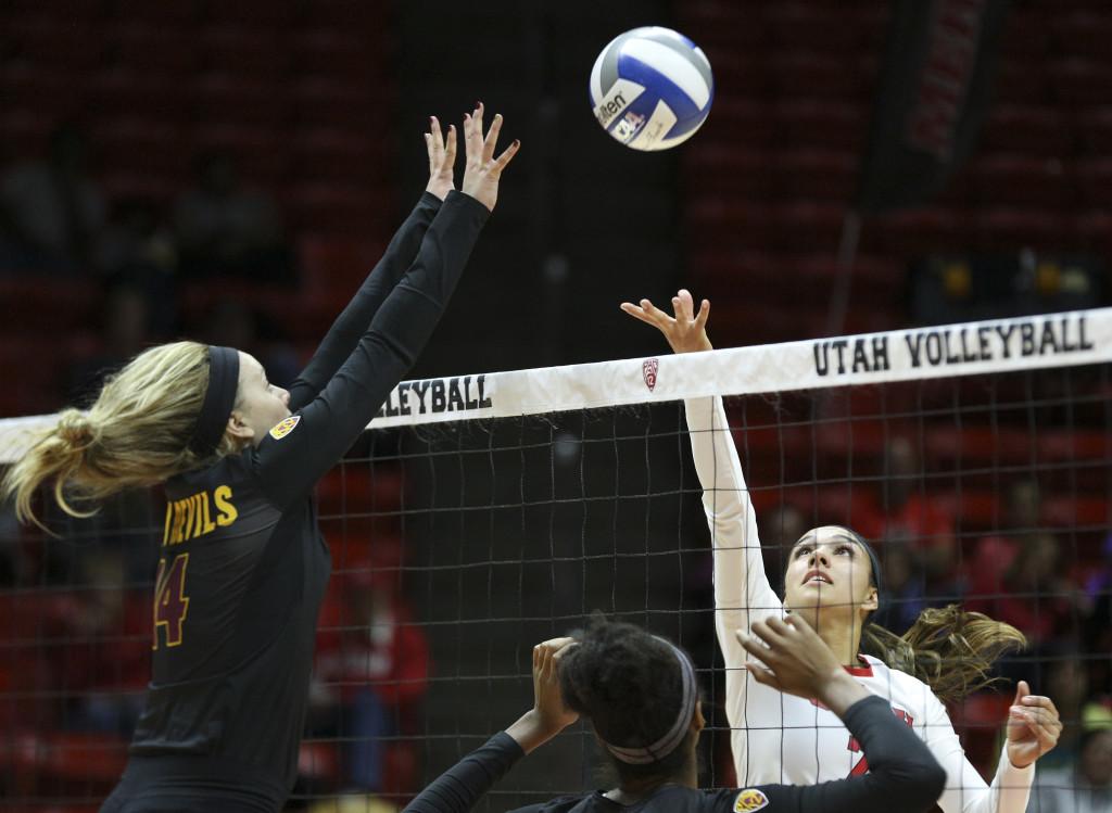Sophomore outside hitter Eliza Katoa, right, tips the ball during a Pac-12 volleyball match against the Arizona State Sun Devils at the Jon M. Huntsman Center, Saturday, Nov 14, 2015. Photo by Chris Ayers.