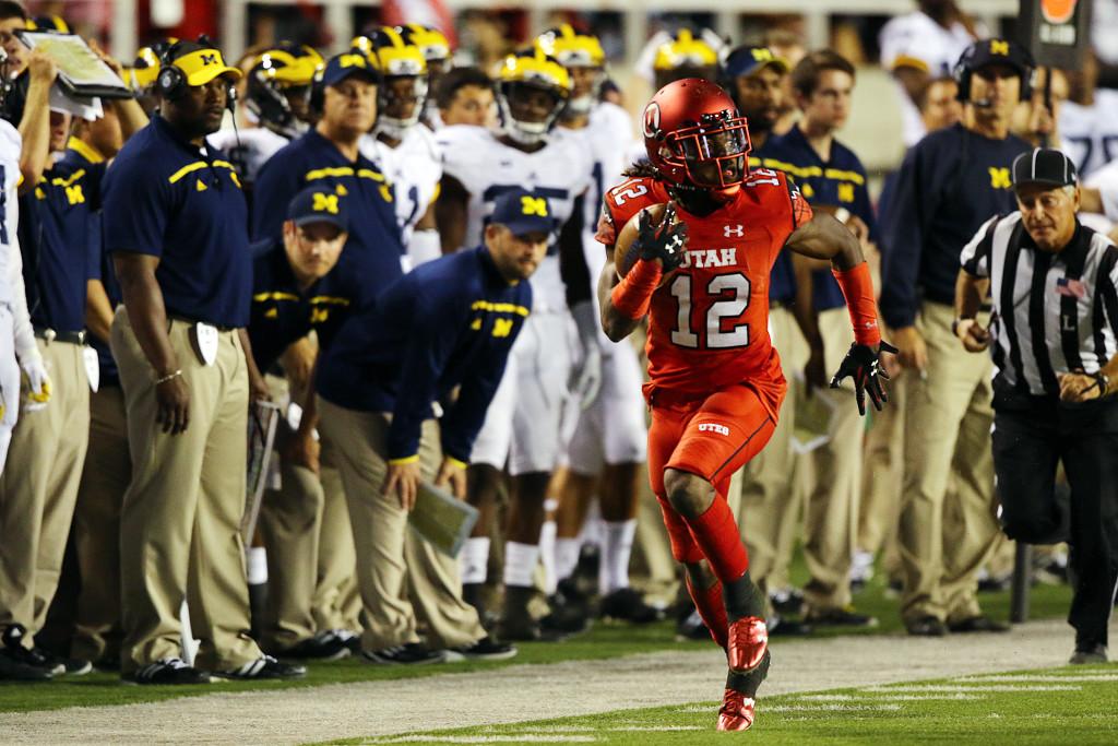 Junior nickel back Justin Thomas (12) runs toward the end zone after intercepting a pass in the second half against the Michigan Wolverines at Rice-Eccles Stadium, Thursday, September 3, 2015. Utah won the contest, 24-17. Chris Samuels, Daily Utah Chronicle.