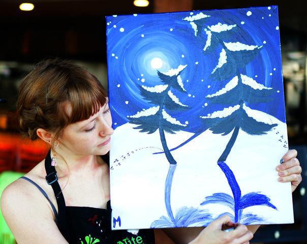 Paint Nite artist Mallory McDaniel works on her painting at Paint Nite inside Squatters Pub in Salt Lake City, Utah, on Sunday, Jan. 17th 2016.
