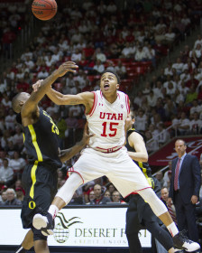 Runnin' Utes junior guard Lorenzo Bonam (15) tries for the ball but ends up in a spasm at the Utah vs Oregon basketball game Thursday January 14, 2016.