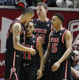 Teammates surround senior guard Brandon Taylor (11) after Taylor was fouled while making a basket during a Pac-12 regular season game against the Cal Golden Bears at the Jon M. Huntsman Center, Wednesday, Jan. 27, 2016. Chris Samuels, Daily Utah Chronicle.