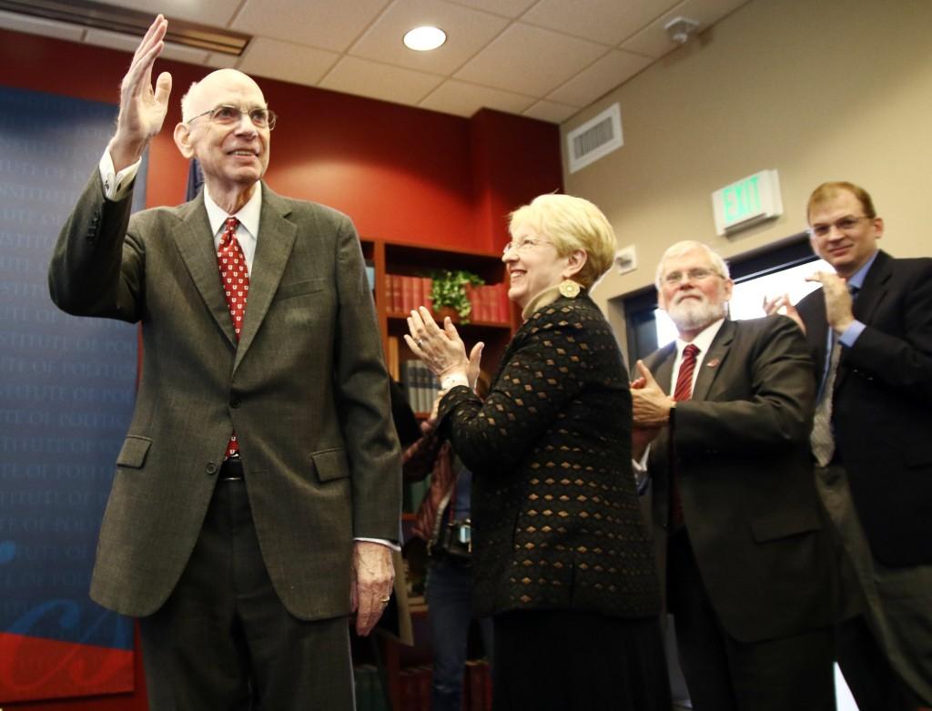 Former U.S. Senator Robert Bennett acknowledges the crowd during a ceremony to induct senator Bennett into the Hinckley Institute of Politics Hall of Fame in the Hinckley Caucus Room in OSH, Wednesday, Jan. 27, 2016. Chris Samuels, Daily Utah Chronicle. Photo credit: Chris Samuels