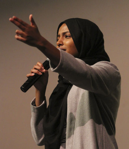 Sabrina Abdalla, a junior in biology, performs a spoken word poem at a rally and march commemorating Martin Luther King, Jr. Day at East High School in Salt Lake City, Monday, Jan. 18, 2016.