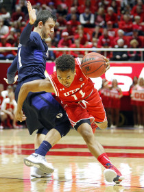 Senior guard Brandon Taylor (11) tried to cut past a defender in the first half of an NCAA men's basketball game against the BYU Cougars at the Jon M. Huntsman Center, Wednesday, Dec. 2, 2015. Chris Samuels, Daily Utah Chronicle.