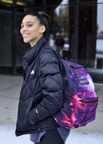 Sydney Duncan a senior double major in Physics and Ballet proudly shows her galaxy backpack to show her love of the cosmos at the Marriot Library on Thursday, Jan. 14, 2016.