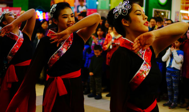 A group of young women perform a traditional Chinese dance during the Chinese New Year Celebration at Chinatown in South Salt Lake, Utah on Saturday, Feb.9th, 2016.  (Rishi Deka, Daily Utah Chronicle)