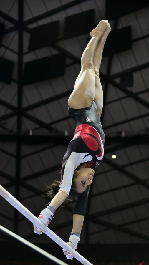 Senior Kailah Delaney performs her uneven bar routine in a meet against the Arizona Wildcats at the Jon M. Huntsman Center on Monday, Feb. 1, 2016. (Kiffer Creveling, Daily Utah Chronicle)