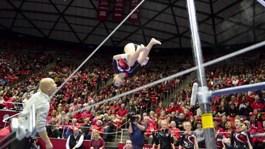 Senior Breanna Hughes attempts a dismount during her bars routine in a meet against the Arizona Wildcats at the Jon M. Huntsman Center on Monday, Feb. 1, 2016. (Kiffer Creveling, Daily Utah Chronicle)