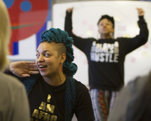 Colored Girls Hustle founder (back) Taja Lindley and cretive collaborator (front) Jessica Valoris get the group loosened up by dancing and rapping at a hip hop femenism workshop, Wednesday Feb. 10, 2016. (Mike Sheehan, Daily Utah Chronicle)