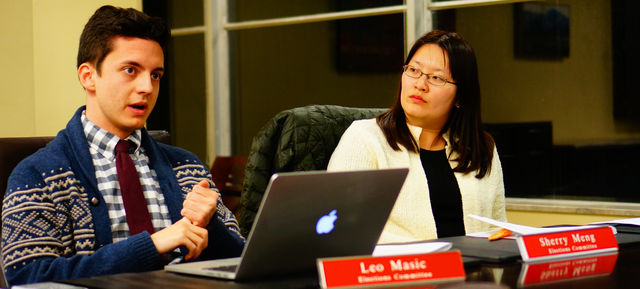 Elections Commitee member Leo Massic, left, speaks while Electrions Commitee member Sherry Meng, right, looks on during the ASUU Grievance against Kylie Petron at the U on Thursday, Feb.18th, 2016. (Rishi Deka, Daily Utah Chronicle)