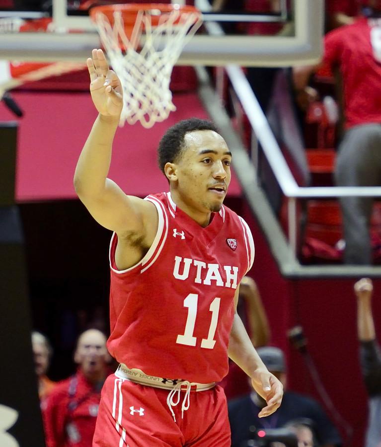 Senior guard Brandon Taylor (11) celebrates after making a three-pointer in the final minute of play in a Pac-12 basketball game versus the Arizona Wildcats in the Jon M. Huntsman Center, Saturday, Feb. 27, 2016. (Kiffer Creveling, Daily Utah Chronicle)