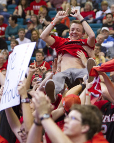 A member of the MUSS crowd surfs at the Pac 12 tournament in Las Vegas, NV, Thursday March 10, 2016. (Mike Sheehan, Daily Utah Chronicle)