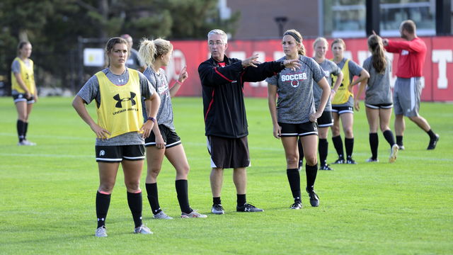Utah head coach, Rich Manning, talks to the Womens soccer team during their practice at Ute Field on Wednesday, Oct. 21, 2015