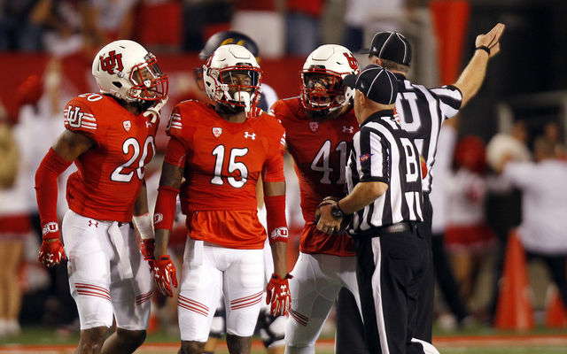 Utah cornerback Dominique Hatfield (15) is congratulated by teammates after catching an interception against the Cal Bears during a Pac-12 football game at Rice Eccles Stadium in Salt Lake City, Saturday, Oct. 10, 2015.