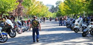 A member of the Combat Veterans Motorcycle Association walks down between the parked bikes in Memory Grove after the culmination of the ride. Aug 27, 2016 Adam Fondren Daily Utah Chronicle