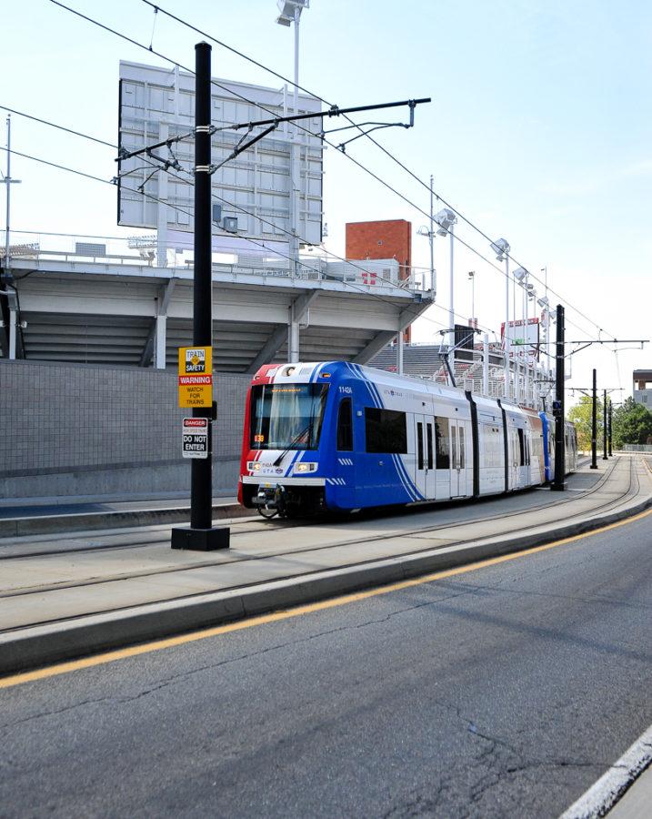 The Red Line TRAX train heading up to the hospital passing underneath Rice-Eccles Stadium on Aug. 30, 2016 | Adam Fondren, The Daily Utah Chronicle