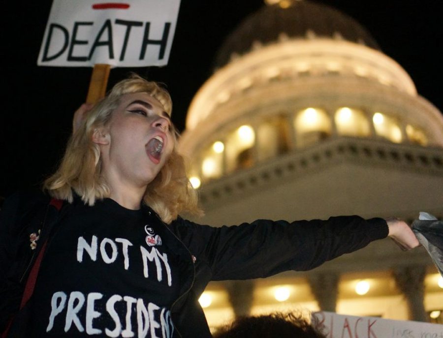 A woman shouts in front of the Utah State Capitol during the Say No to Trumps Agenda rally and protest in Salt Lake City, Utah on Thursday, Nov. 10, 2016. (Rishi Deka, Daily Utah Chronicle)
