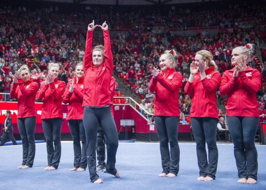 The University of Utah Womens Gymnastics senior Baely Rowe flashes the U after scoring the highest overall points in a meet with Stanford at the John M. Huntsman Center on Friday, March 3, 2017 (Kiffer Creveling | The Daily Utah Chronicle)
