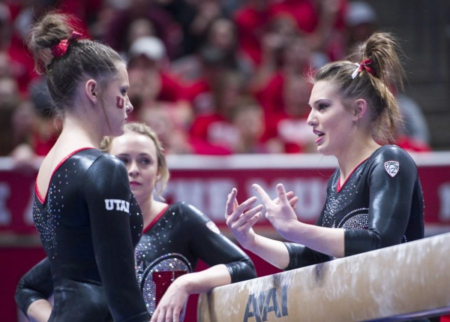 The University of Utah Womens Gymnastics senior Baely Rowe talks with freshman Missy Reinstadtler before her beam routine in a meet with Stanford at the John M. Huntsman Center on Friday, March 3, 2017 