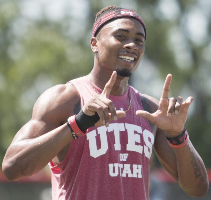 Wide receiver Darren Carrington II smiles and flashes the U at the end of the Utah Utes football practice at Ute Baseball Field on Thursday, Aug. 10, 2017. (Rishi Deka | Daily Utah Chronicle)