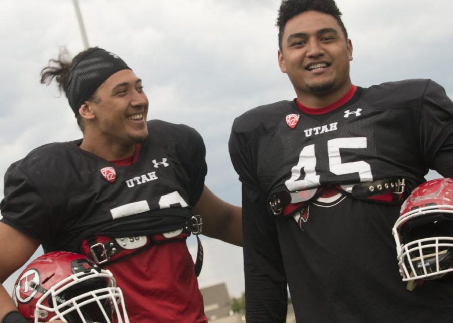 Bradlee Anae, left, and Filipo Mokofisi, right, pose for a photo at the Spence and Cleone Eccles Football Facility on Tuesday, Aug. 22, 2017. (Rishi Deka | Daily Utah Chronicle)