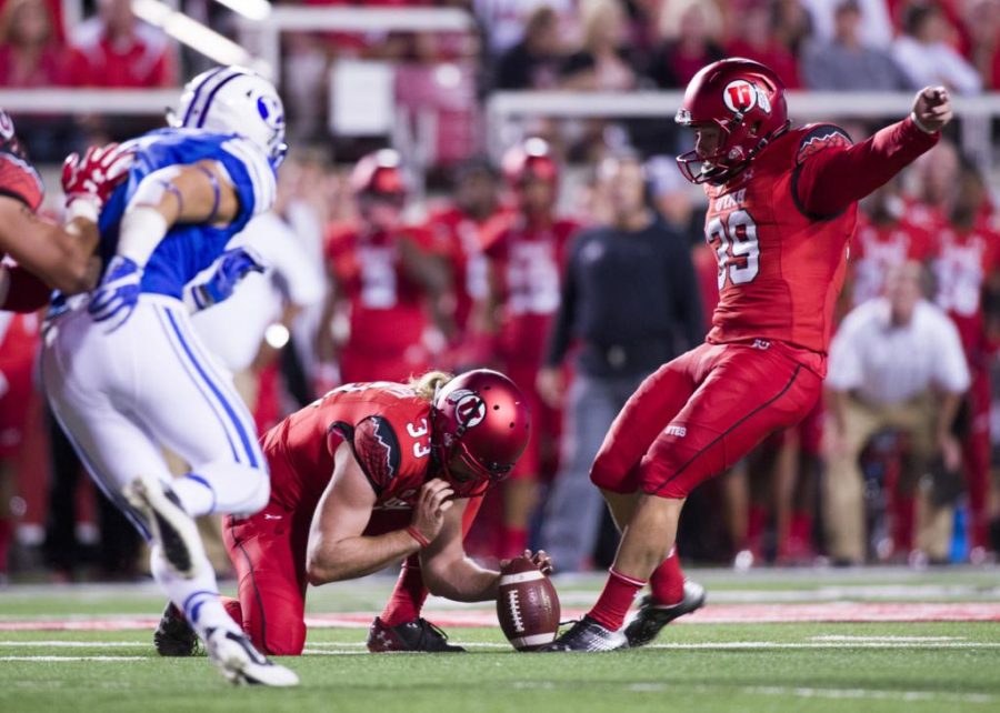 University of Utah Football senior Andy Philips (39) kicks the ball after the touchdown during the game vs. the Brigham Young University Cougars at Rice-Eccles Stadium on Saturday, September 10, 2016