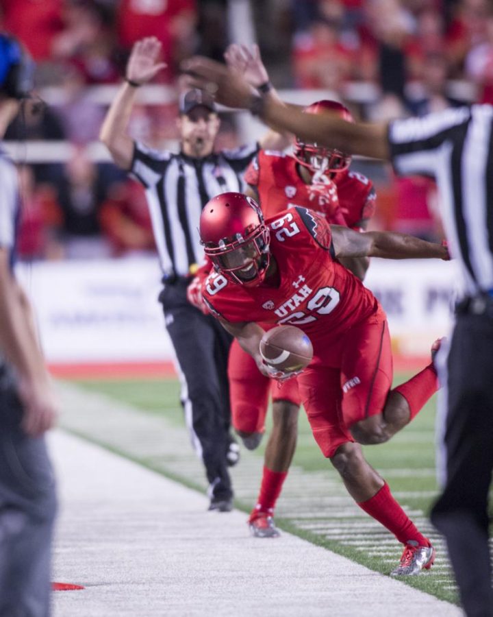 University of Utah Football senior defensive back Reginald Porter (29) makes an interception and runs down the line during the game vs. the Brigham Young University Cougars at Rice-Eccles Stadium on Saturday, September 10, 2016