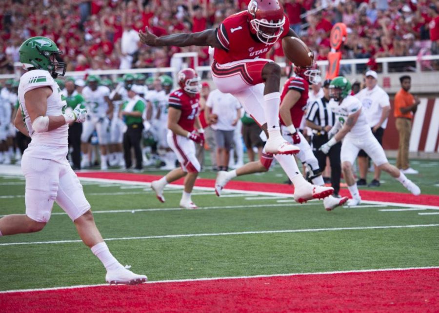 The University of Utah sophomore quarterback Tyler Huntley (1) leaps for the touchdown in an NCAA football game vs. The North Dakota Hawks at Rice Eccles Stadium on Thursday, Aug. 31, 2017

(Photo by Kiffer Creveling | The Daily Utah Chronicle)