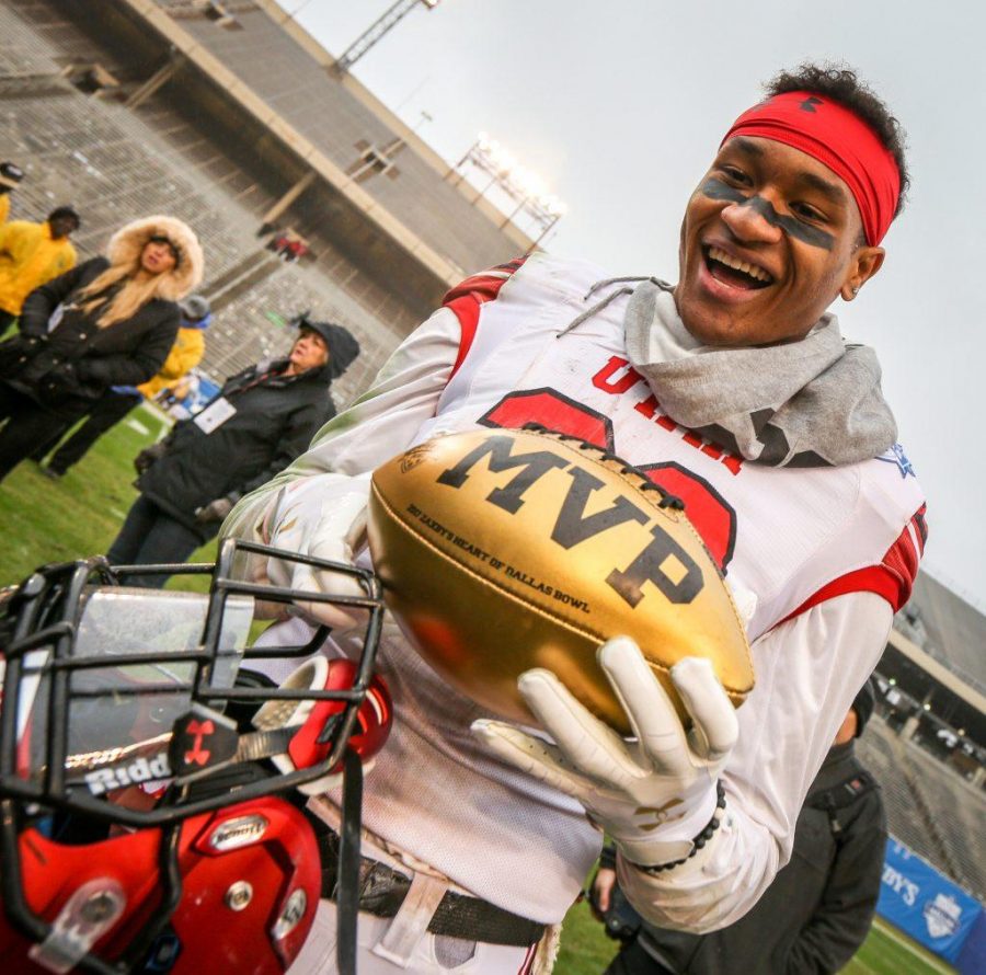Game MVP defensive back Julian Blackmon (23) shows the MVP trophy after the Zaxbys Heart of Dallas Bowl between the Utah Utes and the West Virginia Mountaineers in Dallas Texas on Tuesday, Dec. 26, 2017.