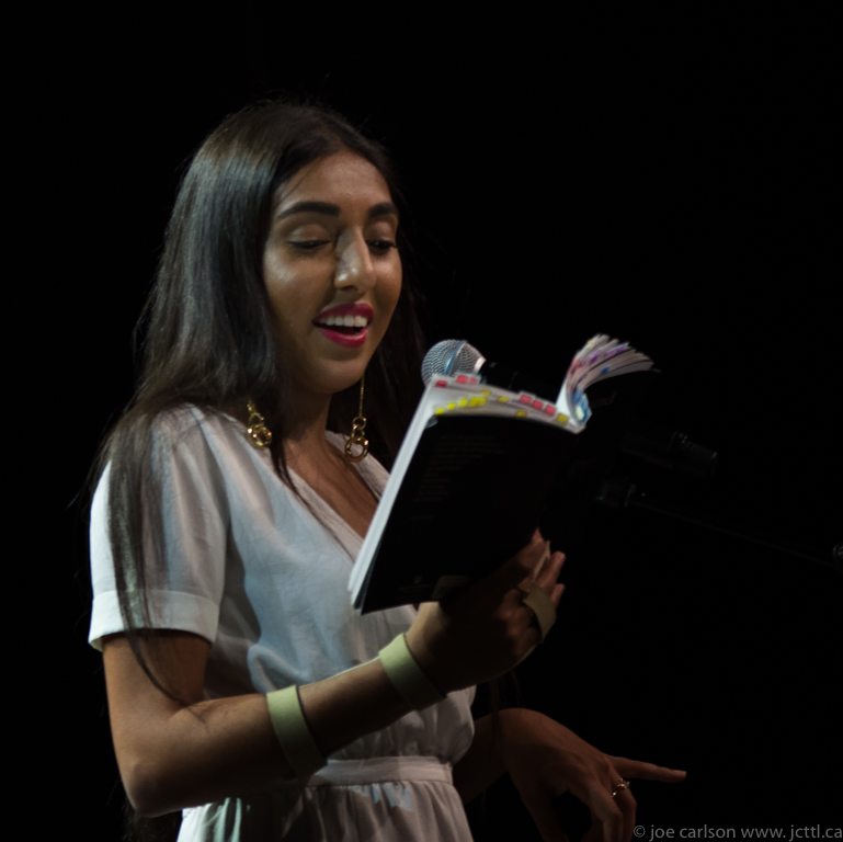 Rupi Kaur reading from her book.