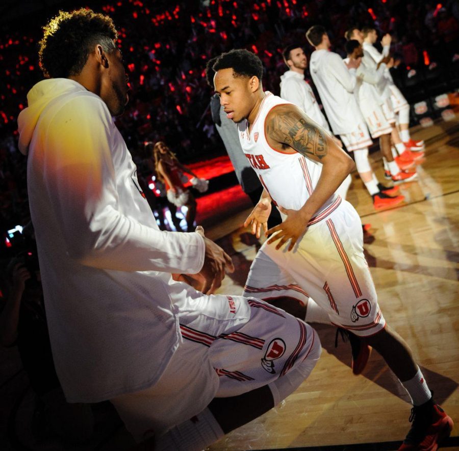 Utah Utes forward Chris Seeley (11) welcomes starter Utah Utes guard Justin Bibbins (1) during the announcement of the starting line-up before the game against the the Colorado Buffaloes in Salt Lake City, UT on Saturday, March 3, 2018