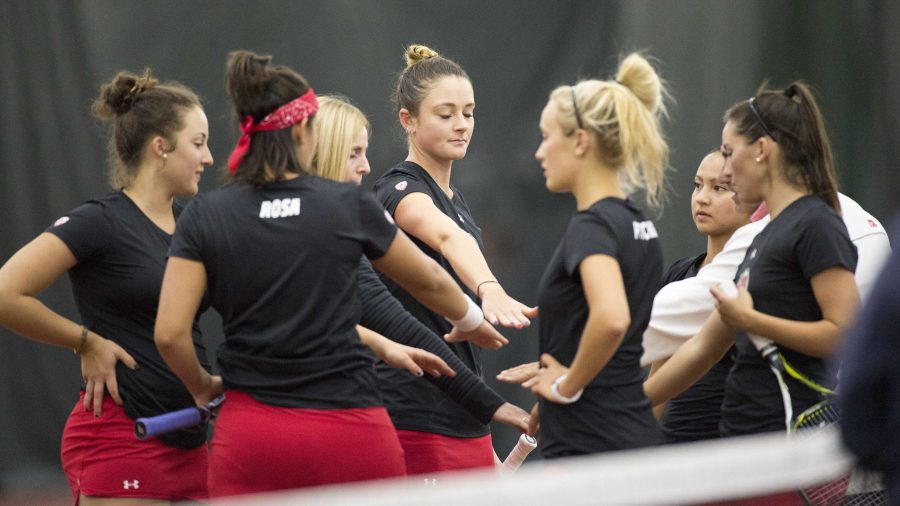 University of Utah Womens Tennis team cheers after the first round of doubles agains the Weber State Wildcats at the George S. Eccles Tennis Center at the University of Utah on Sunday, March 26, 2017